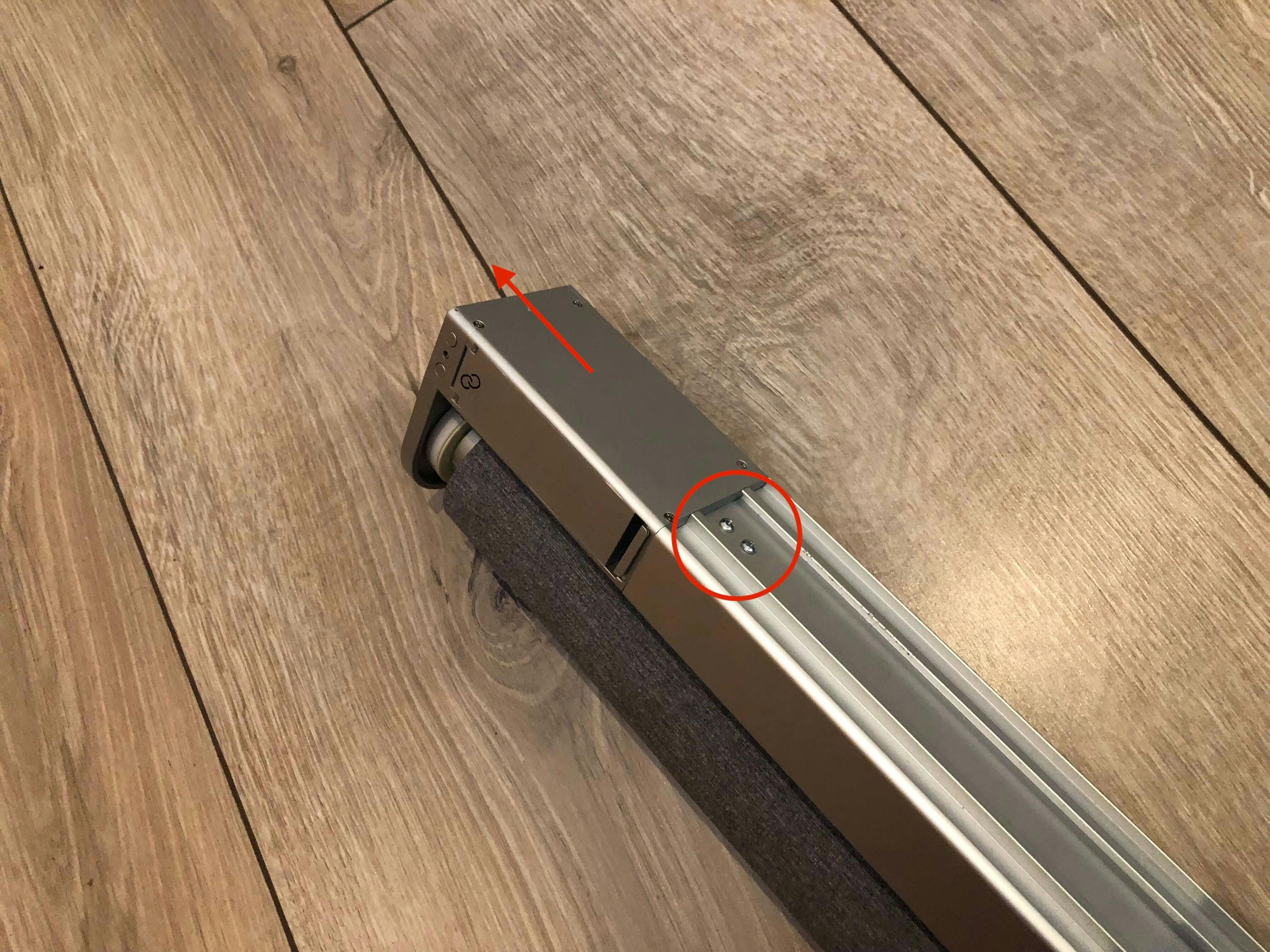 Remove the two screws circled in red, then slide the plastic housing out of the aluminium rail
